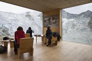 People enjoy the view of the Moiry Glacier the direction of the Moiry mountain hut